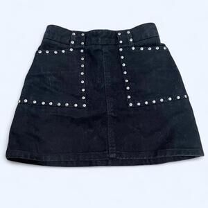 Black denim mini skirt with studded pockets and zipper closure